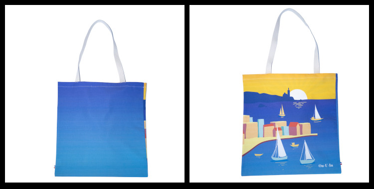 Le tote bag "La Belle Vie" de la marque marseillaise On-U-In, fabriqué en France, 100% coton. Le thème du sac fourre-tout La Belle Vie évoque la mer, les voiliers, la ville de Marseille, un couché de soleil et Notre Dame de La Garde.